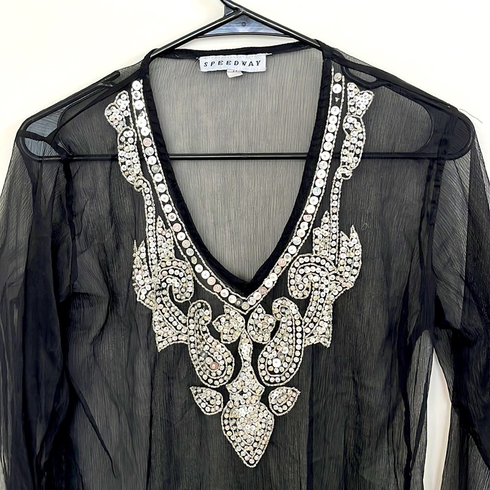 Sheer, black kaftan with silver sequin embroidery.